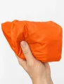 CARGO Market Tote Orange – złożona torba trzymana w dłoni